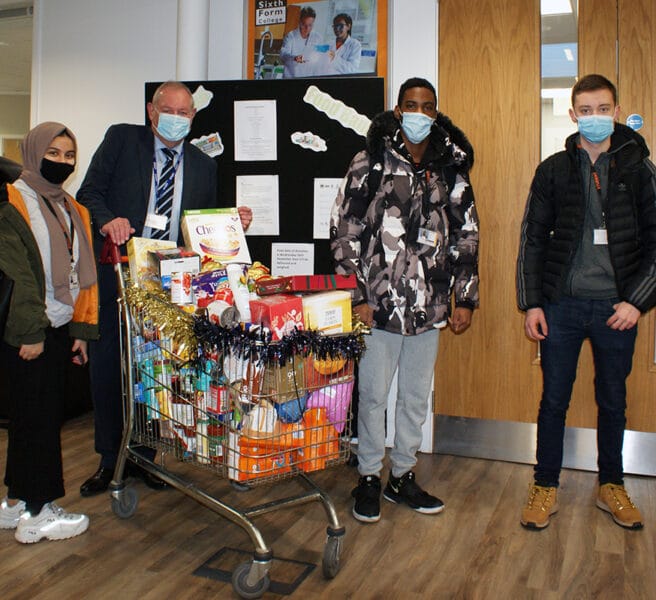 College donates trolley loads of food and toiletries to help those in need this Christmas