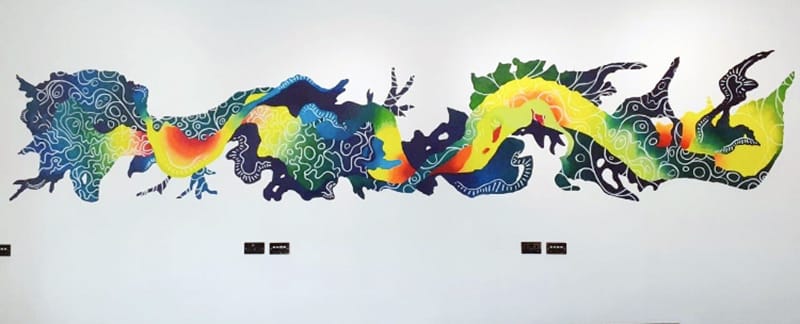 New City College art student João Destro’s vibrant and colourful wall mural is taking pride of place in the Canary Wharf offices of global law firm Clifford Chance.